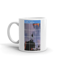 Load image into Gallery viewer, A mug with recaptcha image and direction to select squares with-traffic-lights - photographed and designed by Nate DeWaele - 11oz  handle on left side view of product