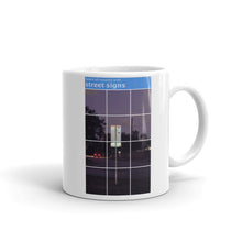Load image into Gallery viewer, A mug with recaptcha image and direction to select squares with street signs - photographed and designed by Nate DeWaele - 11oz right side view of product